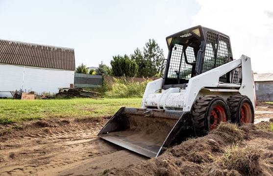 Skid loader on farm