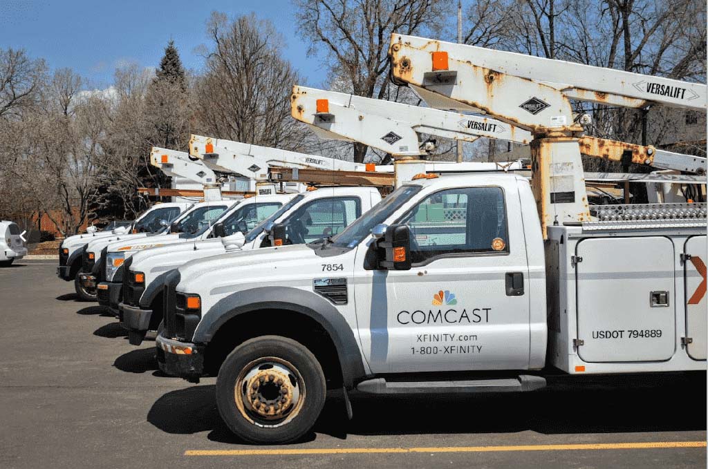 Line of commercial fleet trucks at a maintenance provider